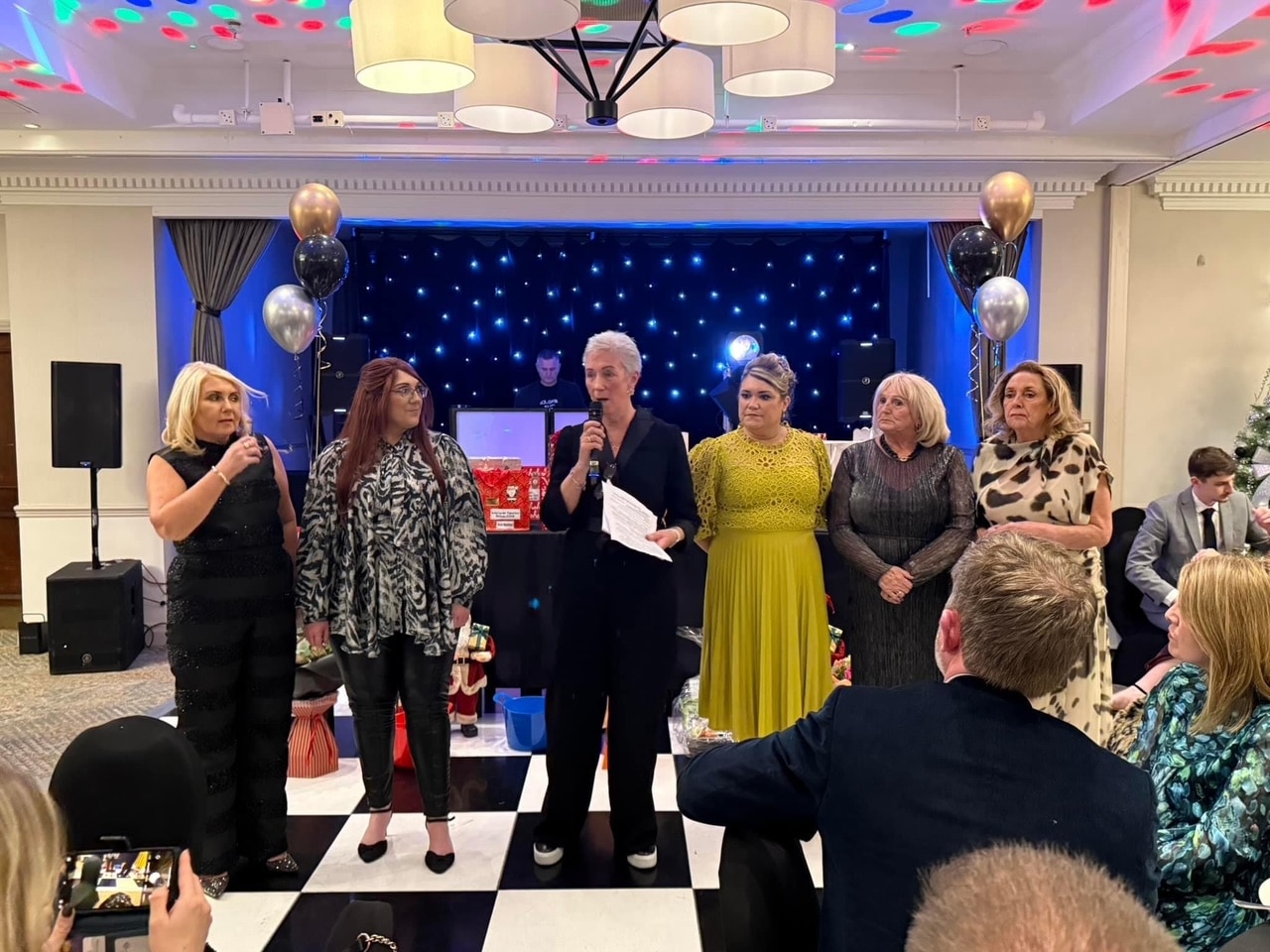 Since our founding, the Sunshine Group has over 550 members, and even our own rooms in Aintree Hospital. I'm the one with the microphone.